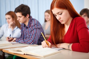 Group of students studying in classroom